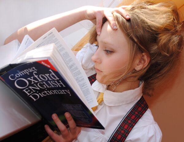 Girl reading English dictionary